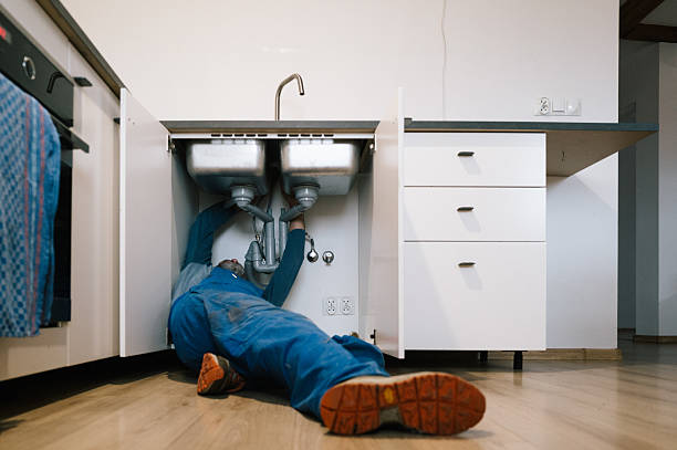 Professional Emergency Plumber technician working in De Witt, IA